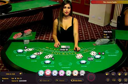 You can play Live Bitcoin blackjack for example at BetChain or FortuneJack.
